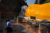 Ayutthaya, Thailand. Wat Yai Chai Mongkhon, 7m- long reclining Buddha, draped in a long orange robe.